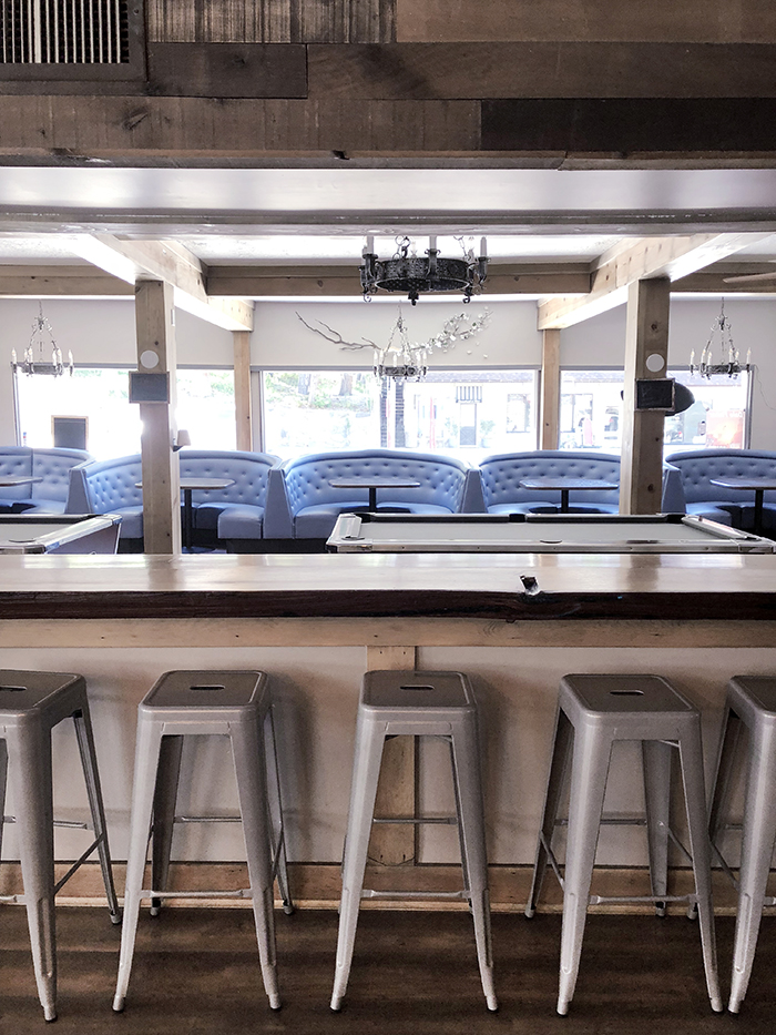 Dogwood Tavern, bar in lake arrowhead, film location, rustic modern, metal stools, blue booths