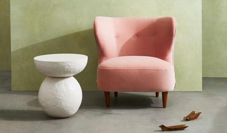 pink chair and stone accent table