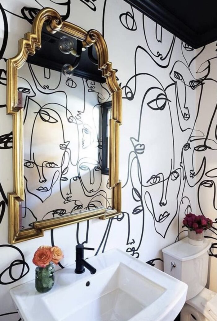 hand painting abstract line art faces on the wall, wallpaper alternative, painted wallpaper, powder room design ideas