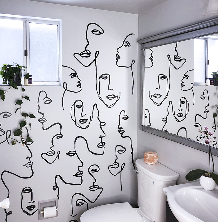 before and after small bathroom makeover with hand painted wall line art faces on the wall, wall paper alternative, drawing on walls, wall mural, accent walls