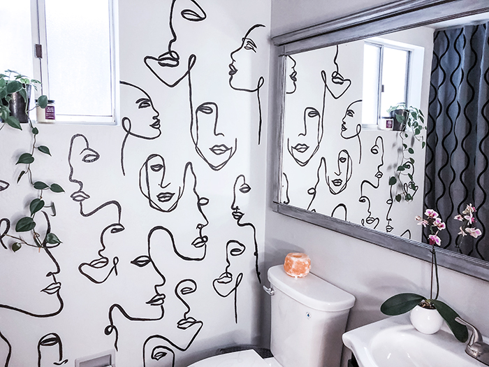 before and after small bathroom makeover with hand painted wall line art faces on the wall, wall paper alternative, drawing on walls, wall mural, accent wall