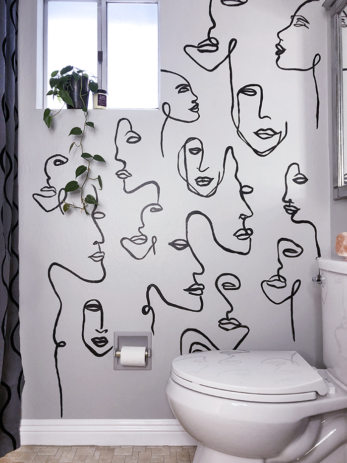 before and after small bathroom makeover with hand painted wall line art faces on the wall, wall paper alternative, drawing on walls, wall mural, accent walls