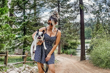 summer dress-summer style-girl holding a french bulldog-style over 40-summer dress and clogs-crocs