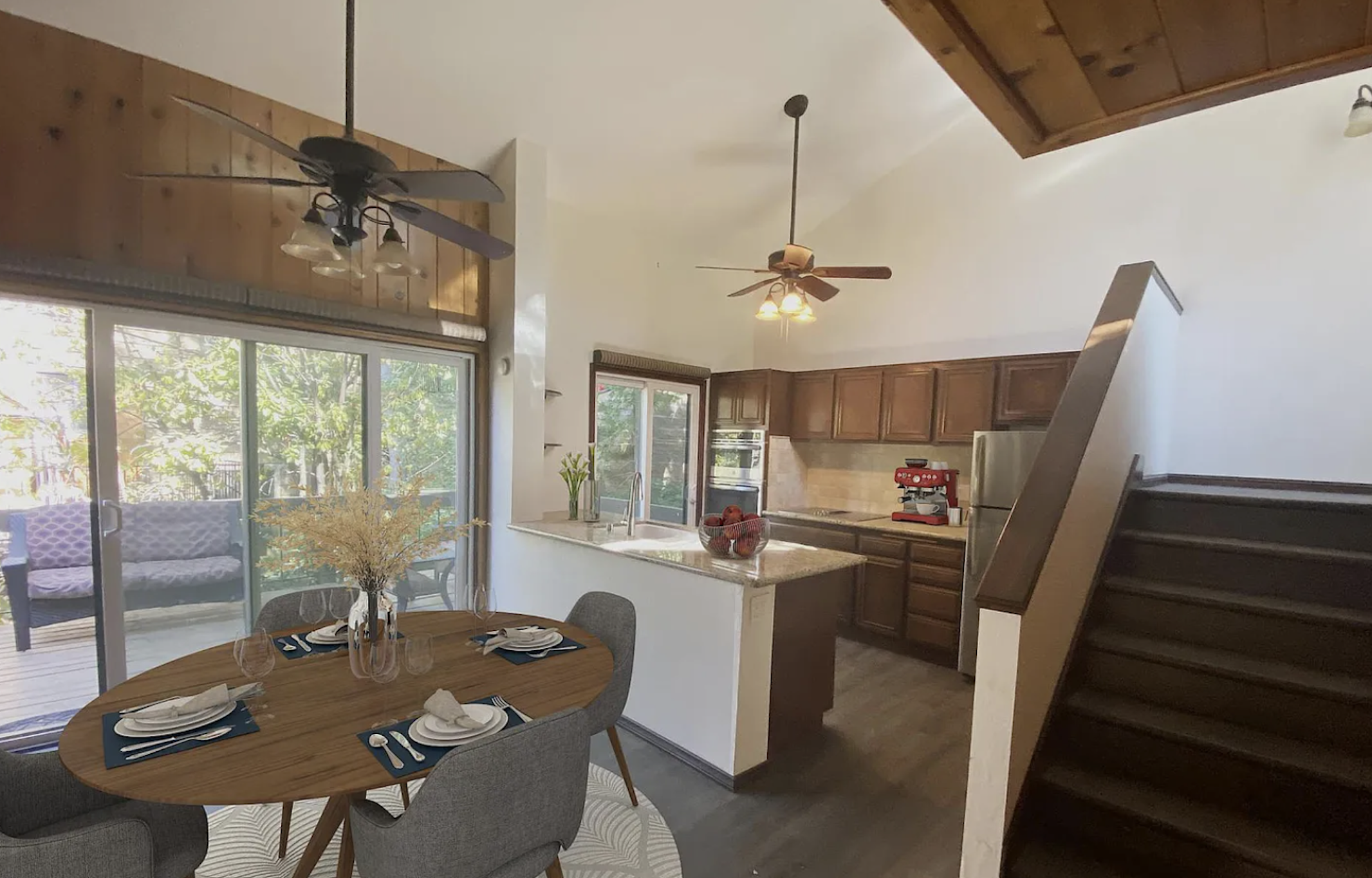 small townhouse kitchen dining room with two ceiling fans