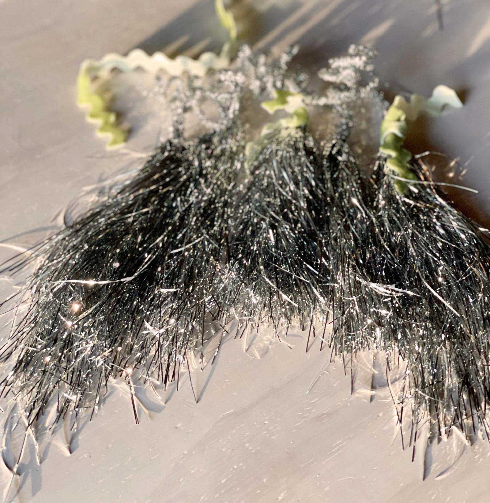 diy silver tinsel tassels Christmas tree ornaments gift wrapping toppers or wine bottle toppe