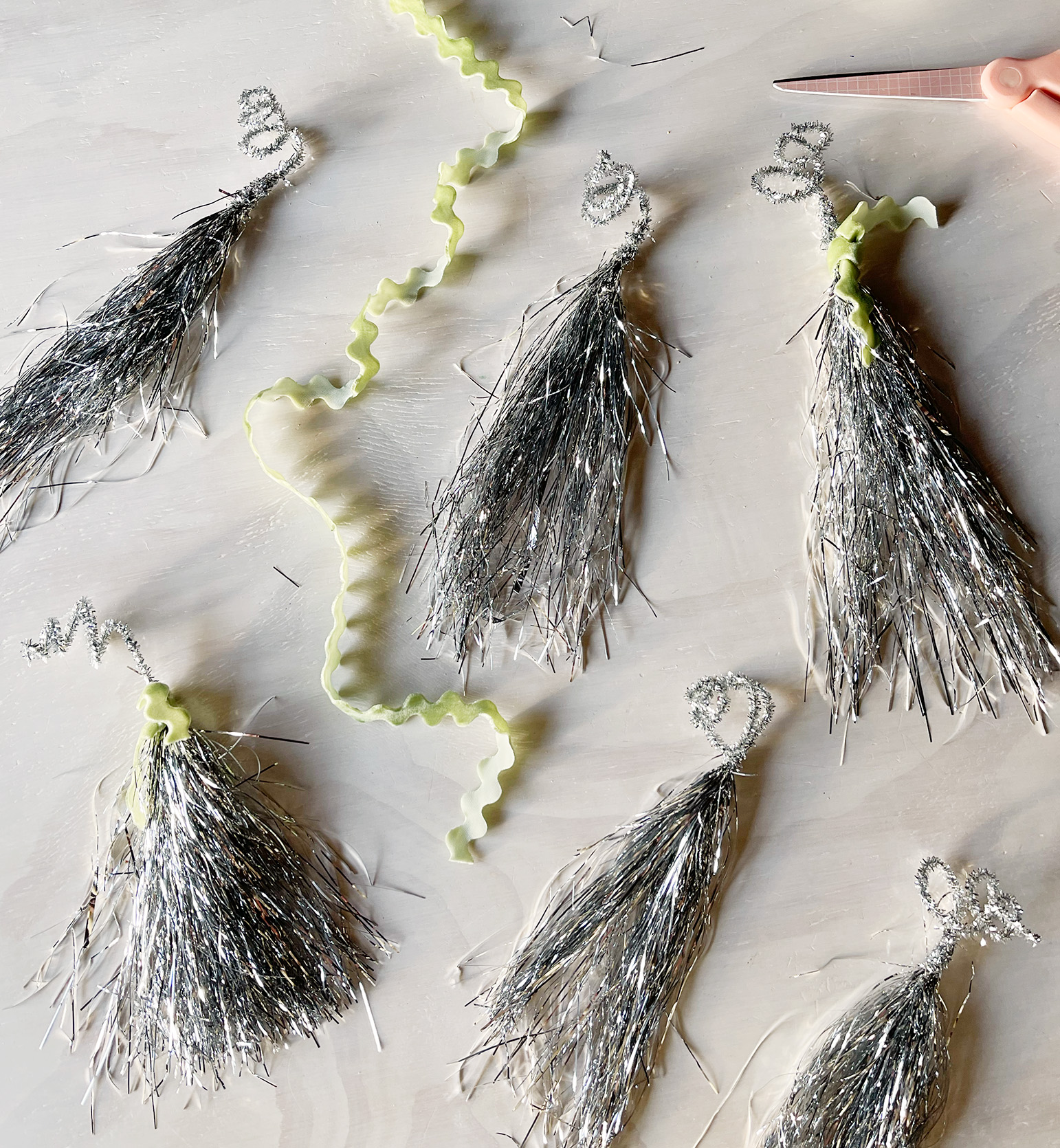 diy silver tinsel tassels Christmas tree ornaments gift wrapping toppers or wine bottle toppe