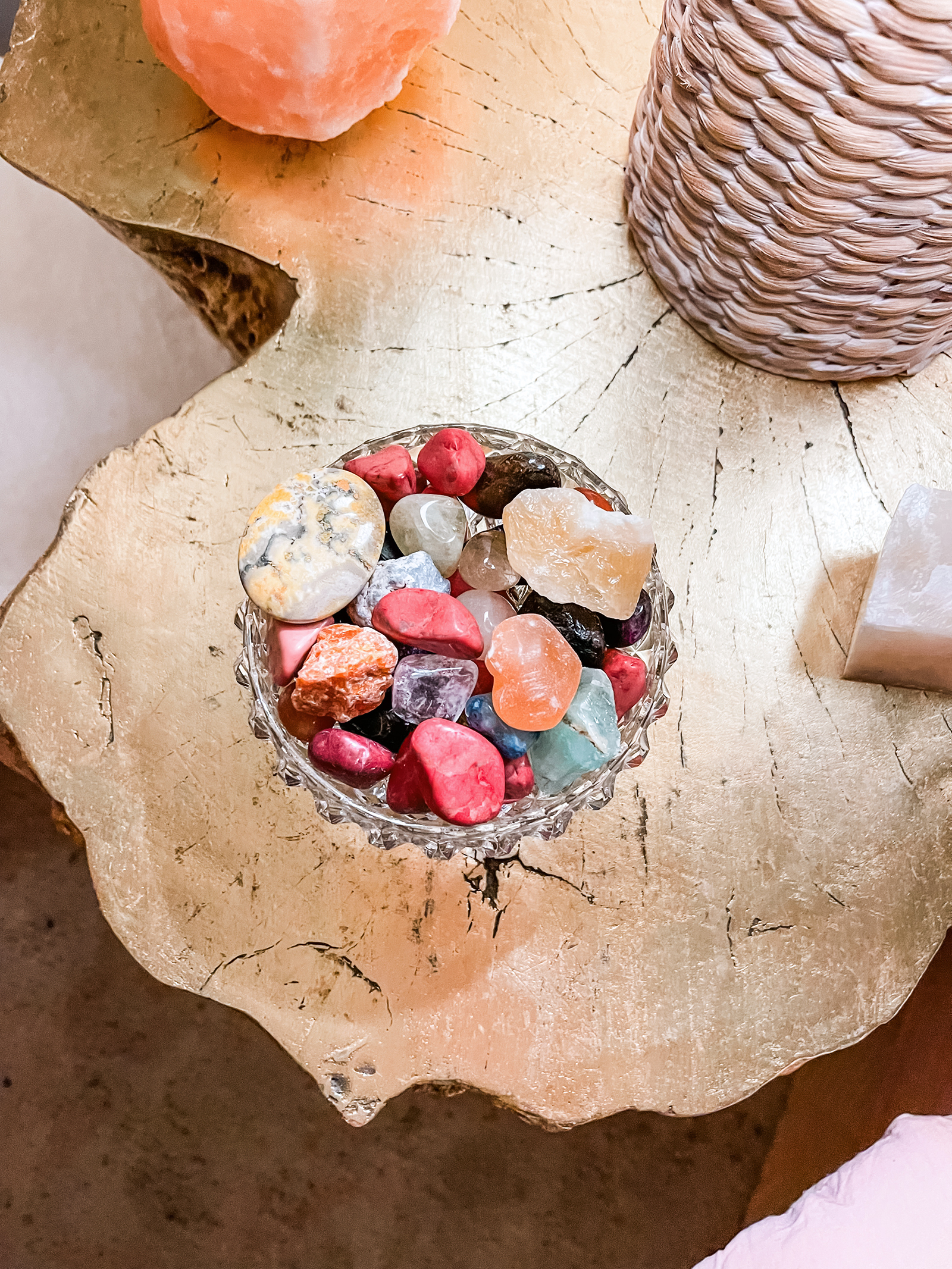 colorful healing crystals in a crystal bowl