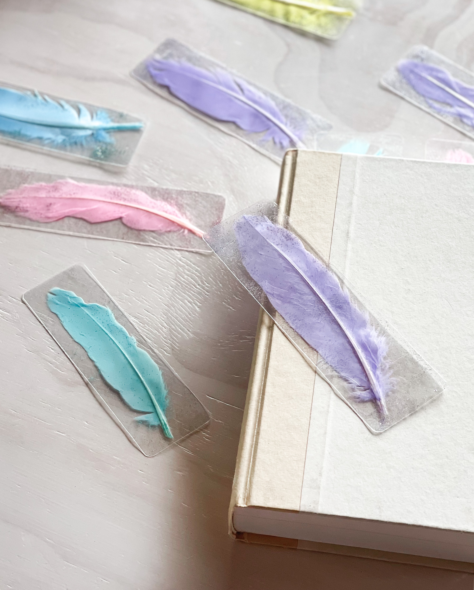 pretty pastel pressed feather and glitter laminated bookmarks