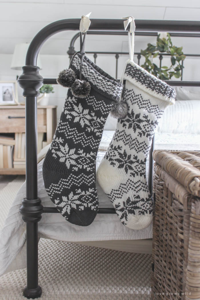christmas stockings hanging from the bed