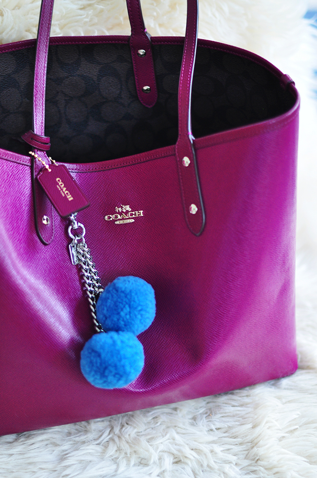 Reversible Coach tote bag with pom pom charm
