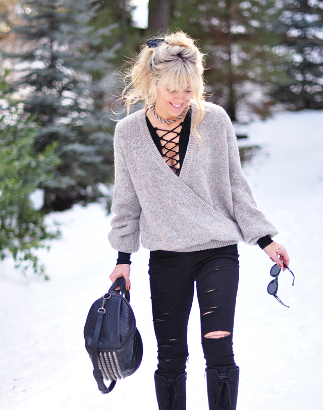 ripped black jeans_lace up top_snow style